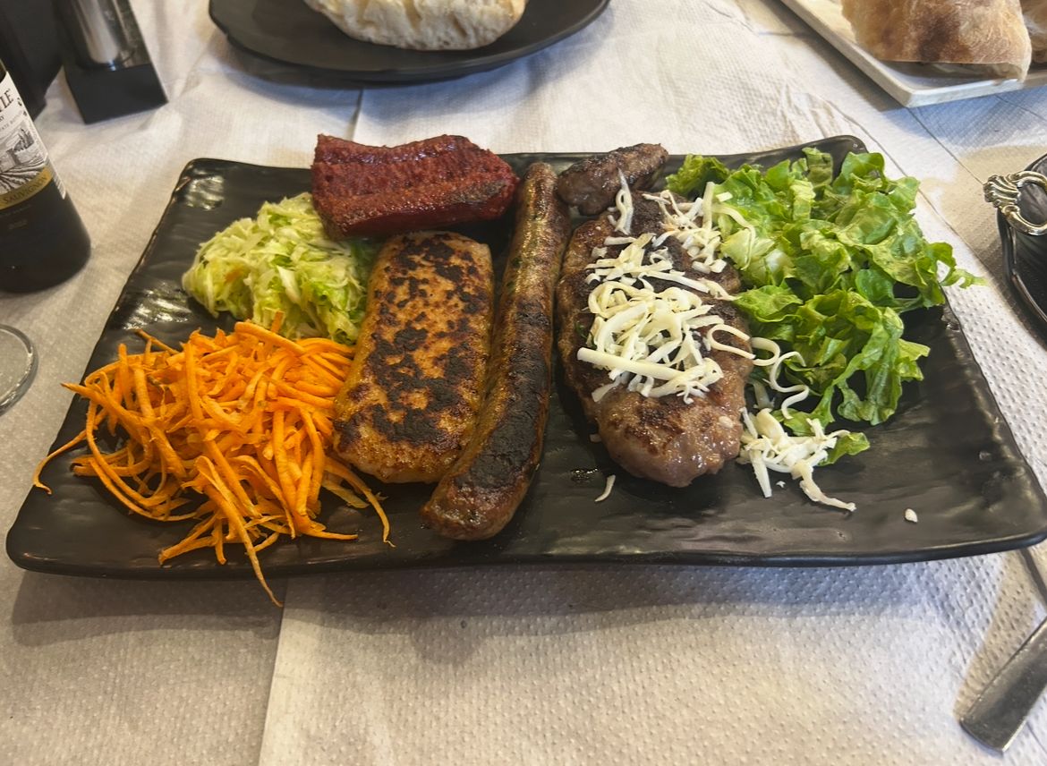 Grilled meat and vegetables at a restaurant in Prizren, Kosovo